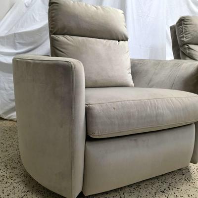 Sale Photo Thumbnail #332: Pair of modern gray microsuede swivel recliners. The recliners have curved armrests, and the light gray velvety fabric feels very elegant.  Each recliner has minor blemishes; most seem superficial dirty spots that could be easily cleaned, but please zoom 
