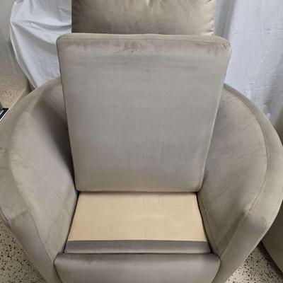 Sale Photo Thumbnail #339: Pair of modern gray microsuede swivel recliners. The recliners have curved armrests, and the light gray velvety fabric feels very elegant.  Each recliner has minor blemishes; most seem superficial dirty spots that could be easily cleaned, but please zoom 