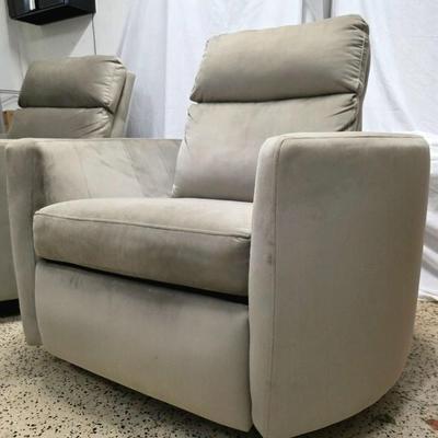 Sale Photo Thumbnail #330: Pair of modern gray microsuede swivel recliners. The recliners have curved armrests, and the light gray velvety fabric feels very elegant.  Each recliner has minor blemishes; most seem superficial dirty spots that could be easily cleaned, but please zoom 