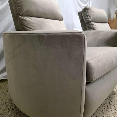 Sale Photo Thumbnail #331: Pair of modern gray microsuede swivel recliners. The recliners have curved armrests, and the light gray velvety fabric feels very elegant.  Each recliner has minor blemishes; most seem superficial dirty spots that could be easily cleaned, but please zoom 