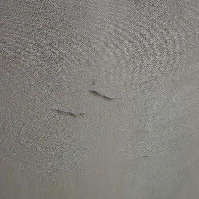 Sale Photo Thumbnail #342: Pair of modern gray microsuede swivel recliners. The recliners have curved armrests, and the light gray velvety fabric feels very elegant.  Each recliner has minor blemishes; most seem superficial dirty spots that could be easily cleaned, but please zoom 