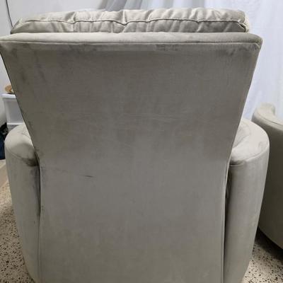 Sale Photo Thumbnail #340: Pair of modern gray microsuede swivel recliners. The recliners have curved armrests, and the light gray velvety fabric feels very elegant.  Each recliner has minor blemishes; most seem superficial dirty spots that could be easily cleaned, but please zoom 