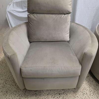 Sale Photo Thumbnail #337: Pair of modern gray microsuede swivel recliners. The recliners have curved armrests, and the light gray velvety fabric feels very elegant.  Each recliner has minor blemishes; most seem superficial dirty spots that could be easily cleaned, but please zoom 