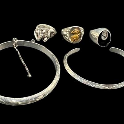 Sale Photo Thumbnail #789: **WIRE TRANSFER IS REQUIRED IF SHIPPED.** [47.71g] Includes two mid-century modern rings, a USMC gent’s ring, a cuff, and a bangle (safety chain needs to be repaired). Total of five pieces. Silver content confirmed using Niton XRF precious metals analyz