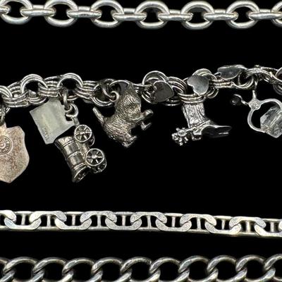 Sale Photo Thumbnail #800: **WIRE TRANSFER IS REQUIRED IF SHIPPED.** [67.94g] Includes a charm bracelet, and three various style curb link bracelets. The clasps are intact. Age related wear. Measurement of longest: 8”. Silver content confirmed using Niton XRF precious metals anal