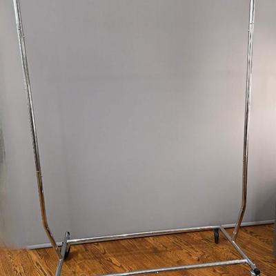 Sale Photo Thumbnail #371: Expandable rolling cloth rack, height and length. Side bars collapse for easy transport. There are 3 available. You are only bidding on one here. Please see items 50KBMN and 51KBM to bid on the others separately.