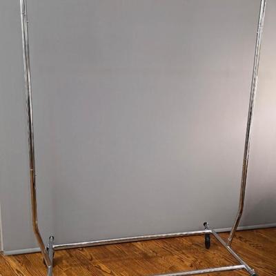 Sale Photo Thumbnail #375: Expandable Rolling Clothing Rack, height and length. Side bars collapse for easy transport. There are 3 available. You are only bidding on one here. Please see items 49KBMN and 50KBM to bid on the others separately.