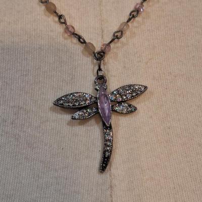 Sale Photo Thumbnail #1379: 1 very long multi strand necklace and a shorter one with dragonfly pendant.