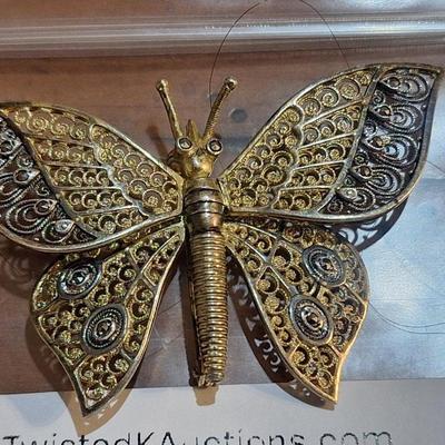 Sale Photo Thumbnail #1381: We can't find the marking for sterling but did find the AC marking.  This brooch is expected to be sterling silver .  The wings are hinged and will move.