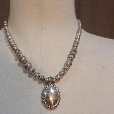 Sale Photo Thumbnail #1396: no markings to indicate metal info or artist info.