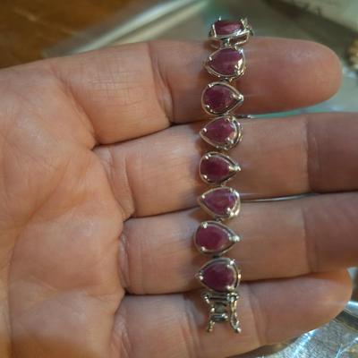 Sale Photo Thumbnail #1407: we could not read the markings- this has a safety latch like it might be sterling but the beads look to be lab created not precious gems.  See photos.