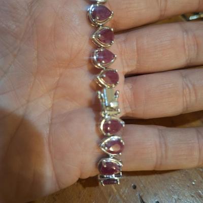 Sale Photo Thumbnail #1405: we could not read the markings- this has a safety latch like it might be sterling but the beads look to be lab created not precious gems.  See photos.