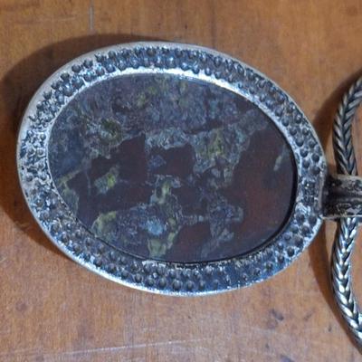 Sale Photo Thumbnail #1549: we are not sure what type of stone this is, the chain is marked 925, could not find a mark on the  pendant ,  please look over photos it also has a necklace extender which has no marking