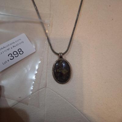 Sale Photo Thumbnail #1547: we are not sure what type of stone this is, the chain is marked 925, could not find a mark on the  pendant ,  please look over photos it also has a necklace extender which has no marking