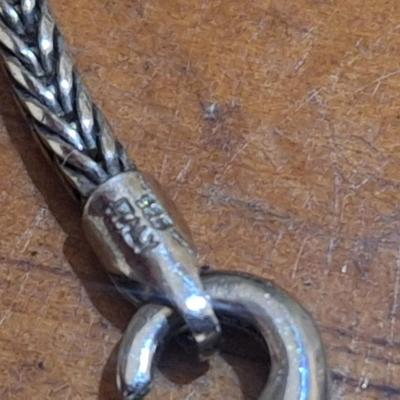 Sale Photo Thumbnail #1548: we are not sure what type of stone this is, the chain is marked 925, could not find a mark on the  pendant ,  please look over photos it also has a necklace extender which has no marking