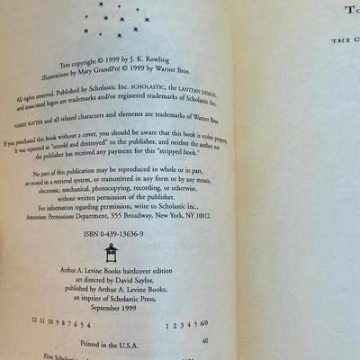 Sale Photo Thumbnail #203: Titles include: Harry Potter and the Sorcerer's Stone, Harry Potter and The Chamber of Secrets, and Harry Potter and The Prisoner of Azkaban.  One book has som pages curled up at the bottom corner, but are all otherwise in good, used condition.