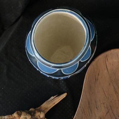 African soapstone tribal vase with ceramic leaf - handcrafted wooden candle holder and a unique piece of burl wood