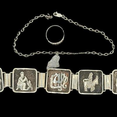 Sale Photo Thumbnail #829: **WIRE TRANSFER IS REQUIRED IF SHIPPED.** [34.72g] Includes a sterling marcasite ring, a sterling ankle bracelet with a State of Maine charm, and a South American panel bracelet in .900 silver. Total of three pieces. Measurement of longest: 10”. Age rel
