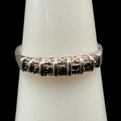 Sale Photo Thumbnail #833: **WIRE TRANSFER IS REQUIRED IF SHIPPED.** [34.72g] Includes a sterling marcasite ring, a sterling ankle bracelet with a State of Maine charm, and a South American panel bracelet in .900 silver. Total of three pieces. Measurement of longest: 10”. Age rel