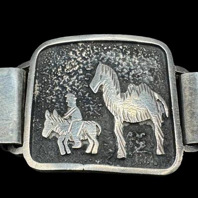 Sale Photo Thumbnail #830: **WIRE TRANSFER IS REQUIRED IF SHIPPED.** [34.72g] Includes a sterling marcasite ring, a sterling ankle bracelet with a State of Maine charm, and a South American panel bracelet in .900 silver. Total of three pieces. Measurement of longest: 10”. Age rel