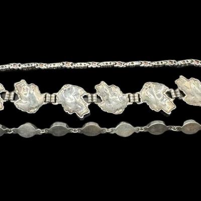 Sale Photo Thumbnail #836: **WIRE TRANSFER IS REQUIRED IF SHIPPED.** [52.15g] Includes a garnet cabochon bracelet, a prong set citrine bracelet, and a Danish style leaf motif bracelet. Total of three pieces. Measurement of longest: 8”. Silver content confirmed using Niton XRF pre