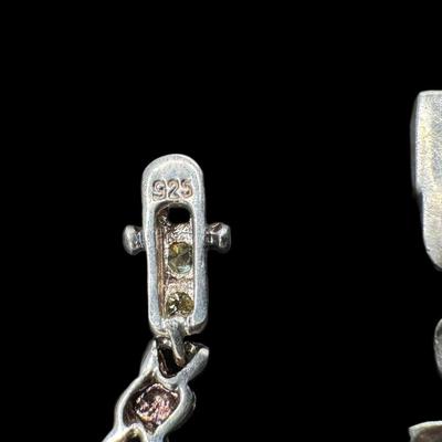 Sale Photo Thumbnail #839: **WIRE TRANSFER IS REQUIRED IF SHIPPED.** [52.15g] Includes a garnet cabochon bracelet, a prong set citrine bracelet, and a Danish style leaf motif bracelet. Total of three pieces. Measurement of longest: 8”. Silver content confirmed using Niton XRF pre