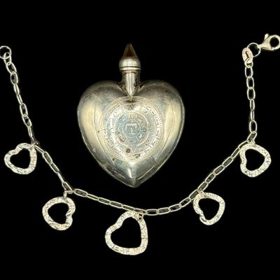 Sale Photo Thumbnail #840: **WIRE TRANSFER IS REQUIRED IF SHIPPED.** [22.20g] Includes a vintage heart perfume bottle, and a floating heart ankle bracelet. Total of two pieces. Age related wear. Silver content confirmed using Niton XRF precious metals analyzer. **ALL PRECIOUS METAL