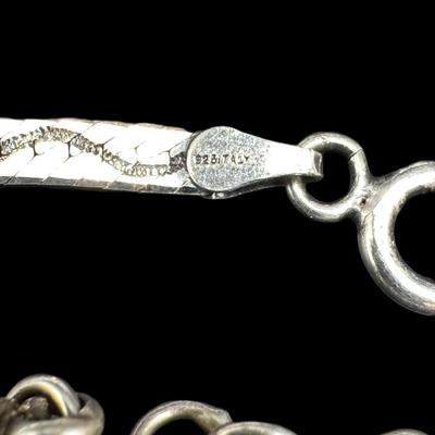 Sale Photo Thumbnail #846: **WIRE TRANSFER IS REQUIRED IF SHIPPED.** [31.85g] Includes an elephant chain bracelet, a Byzantine style bracelet, a herringbone bracelet, and more. Total of four pieces. Measurement of longest: 7.5”. Silver content confirmed using Niton XRF precious m