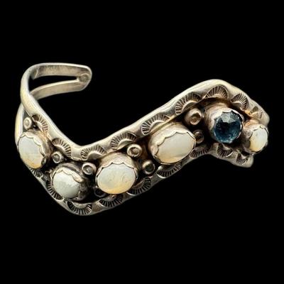 Sale Photo Thumbnail #850: **WIRE TRANSFER IS REQUIRED IF SHIPPED.** [53.48g] Includes a bezel set moonstone and topaz cuff, and a Tuareg style cuff. Total of two pieces. Measurement: 2.5” Diameter (each). Silver content confirmed using Niton XRF precious metals analyzer. **ALL P