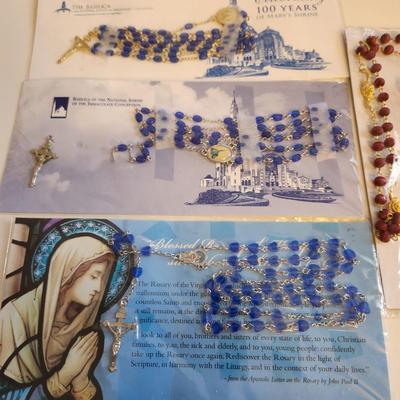 Sale Photo Thumbnail #376: This auction lot is for a collection of Religious Ephemera and Three Rosaries. Contains bookmarks, prayer cards and other interesting printed media reflecting Christian culture. Plus three nice rosaries still in the original wrapping.