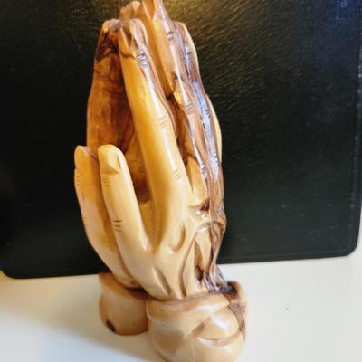 Sale Photo Thumbnail #383: This auction lot is for a Carved Wood Praying Hand Statue. Interesting and quite dimensional. Appears to be carved from cedar wood.