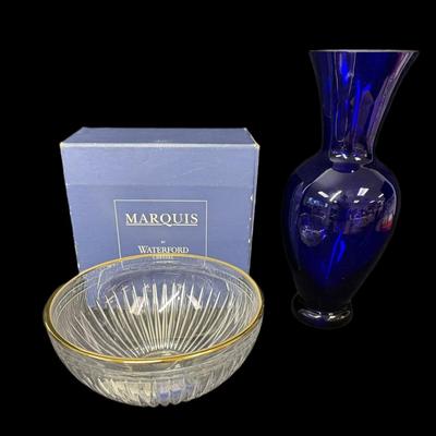 Sale Photo Thumbnail #876: Includes a Waterford Marquis Hanover Gold crystal bowl, and a Block Crystal of Stockholm cobalt blue vase. Total of two pieces. Age related wear. Measurement of largest: 15”H. [CS]