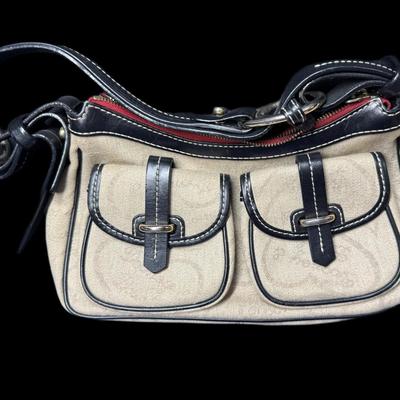 Sale Photo Thumbnail #880: Includes a Lulu Lemon crossbody wallet, a Coach bag, and a Dooney & Bourke bag. Total of three pieces. Age related wear. Measurement of largest: 13”. [CS]