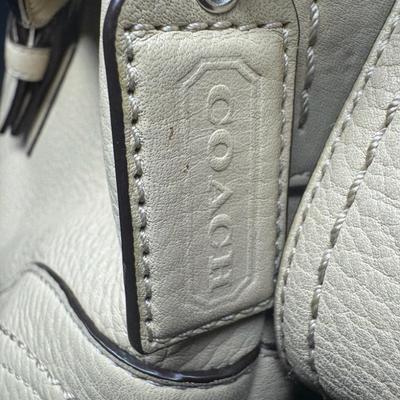 Sale Photo Thumbnail #883: Includes a Lulu Lemon crossbody wallet, a Coach bag, and a Dooney & Bourke bag. Total of three pieces. Age related wear. Measurement of largest: 13”. [CS]