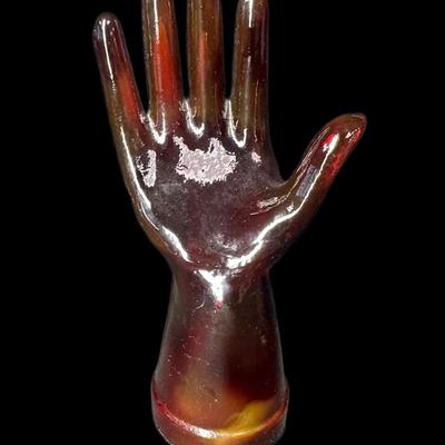 Sale Photo Thumbnail #888: Includes a carved jade fisherman, a Noah cow bell, a Robert De Niro signed painting, a Kaas Glassworks trinket dish, and more. Total of five pieces. Measurement of largest: 12”L. [CS]