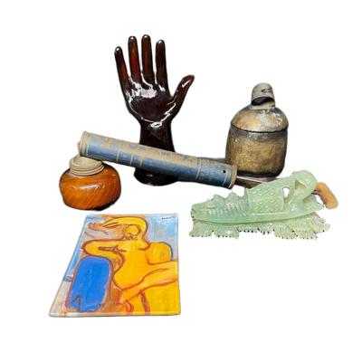 Sale Photo Thumbnail #884: Includes a carved jade fisherman, a Noah cow bell, a Robert De Niro signed painting, a Kaas Glassworks trinket dish, and more. Total of five pieces. Measurement of largest: 12”L. [CS]