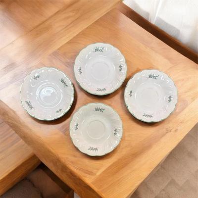 Sale Photo Thumbnail #24: Nikko Happy Holidays Christmas Tree Footed Cups, Saucers and Large Plate.  4 large cups, one small cup, four saucers and one dinner plate.
Made in Japan.