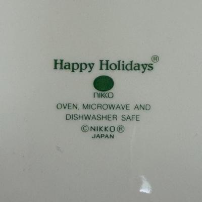 Sale Photo Thumbnail #22: Nikko Happy Holidays Christmas Tree Footed Cups, Saucers and Large Plate.  4 large cups, one small cup, four saucers and one dinner plate.
Made in Japan.