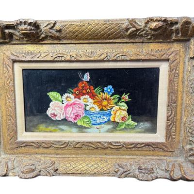 Sale Photo Thumbnail #893: This is believed to be a Dulce Hernandez Beatriz (Cuban) still life. It is painted on board, and has a gilded gesso frame. There is age related wear. Measurement: 19” x 13”. [CS]