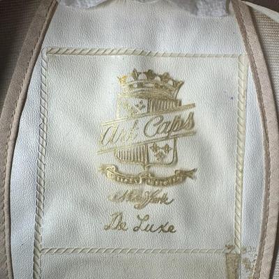 Sale Photo Thumbnail #913: This Naval white peak cap belonged to a master swimmer. The size is unmarked/unknown. Age related wear. Measurement: 11.75” Diameter. [CS]