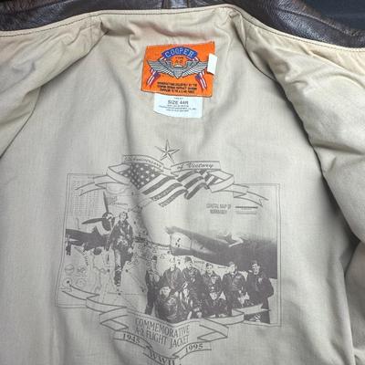 Sale Photo Thumbnail #919: A depiction of the 50th Anniversary of the close of WW2 is on the inside. The jacket was made in USA, in 1995. Size is 44R. [CS]