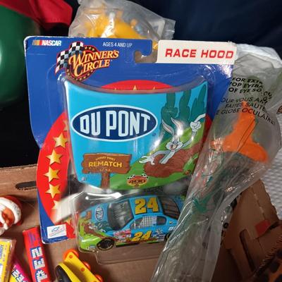 A BOX WITH A VARIETY OF TOYS