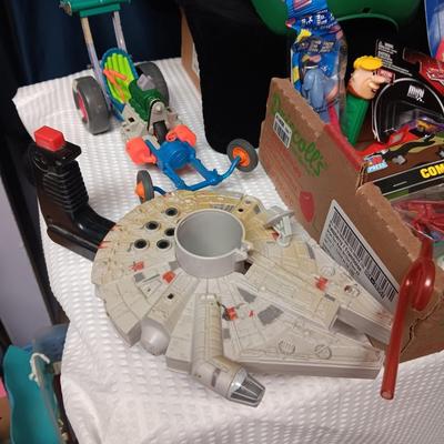 A BOX WITH A VARIETY OF TOYS