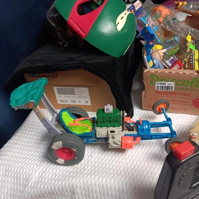 A BOX WITH A VARIETY OF TOYS