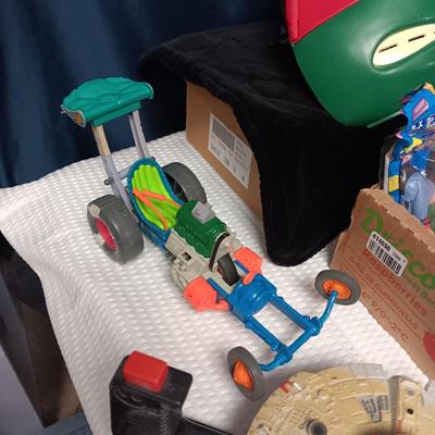 A BOX WITH A VARIETY OF TOYS