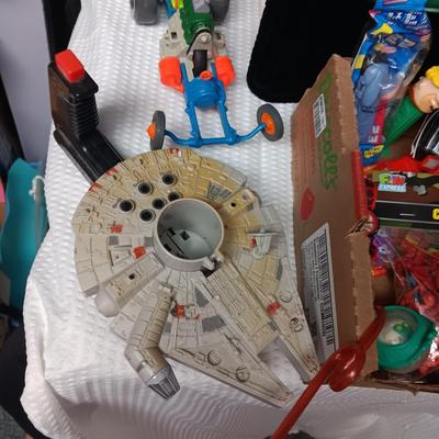 A BOX WITH A VARIETY OF TOYS