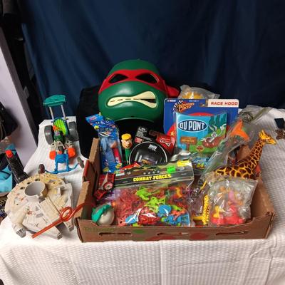 A BOX WITH A VARIETY OF TOYS