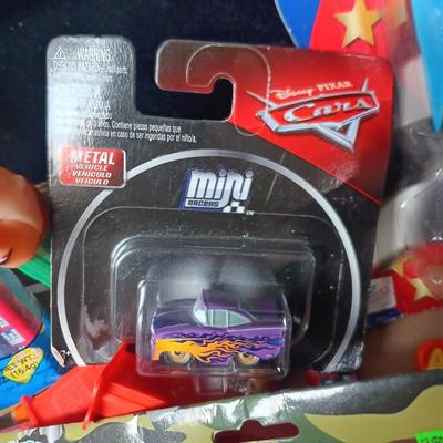 A BOX WITH A VARIETY OF TOYS