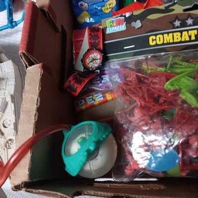 A BOX WITH A VARIETY OF TOYS