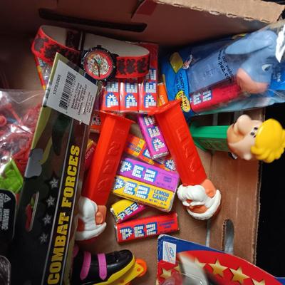 A BOX WITH A VARIETY OF TOYS